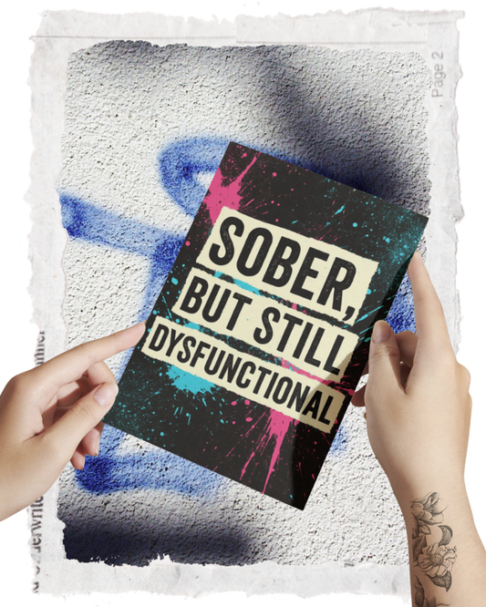 Card titled 'Sober, But Still Dysfunctional' held by hands against a textured background